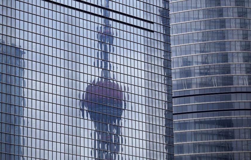 The Oriental Pearl TV Tower is reflected on the facade of another building at Pudong financial district in Shanghai April 2, 2014. Economists who predict a collapse in Chinau00e2u20acu2122s property and stock markets are hoping for u00e2u20acu02dctold you sou00e2u20acu2122 moment. u00e2u20acu201d Reute