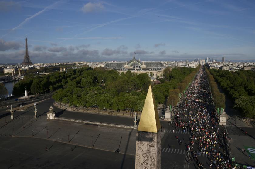 View of the Paris skyline, including the Eiffel Tower, as competitors in the 38th Paris Marathon run down the Champs Elysees below the Arc de Triomphe after the start of the footrace in Paris April 6, 2014. u00e2u20acu201d Reuters pic