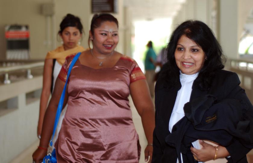 Deepa Subramaniam (left) and her lawyer Jayamalar Raman (right) outside the High Court in Seremban on April 7, 2014. u00e2u20acu201d Picture by Yusof Mat Isa