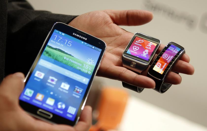 The new Samsung Galaxy S5 smartphone (left), Gear 2 smartwatch (centre) and Gear Fit fitness band are displayed at the Mobile World Congress in Barcelona February 23, 2014. u00e2u20acu201d Reuters pic