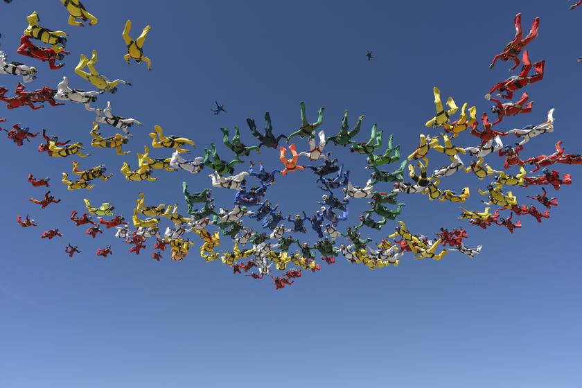 Skydivers form a missing man formation in Eloy, Arizona, April 3, 2014. u00e2u20acu201d Reuters pic