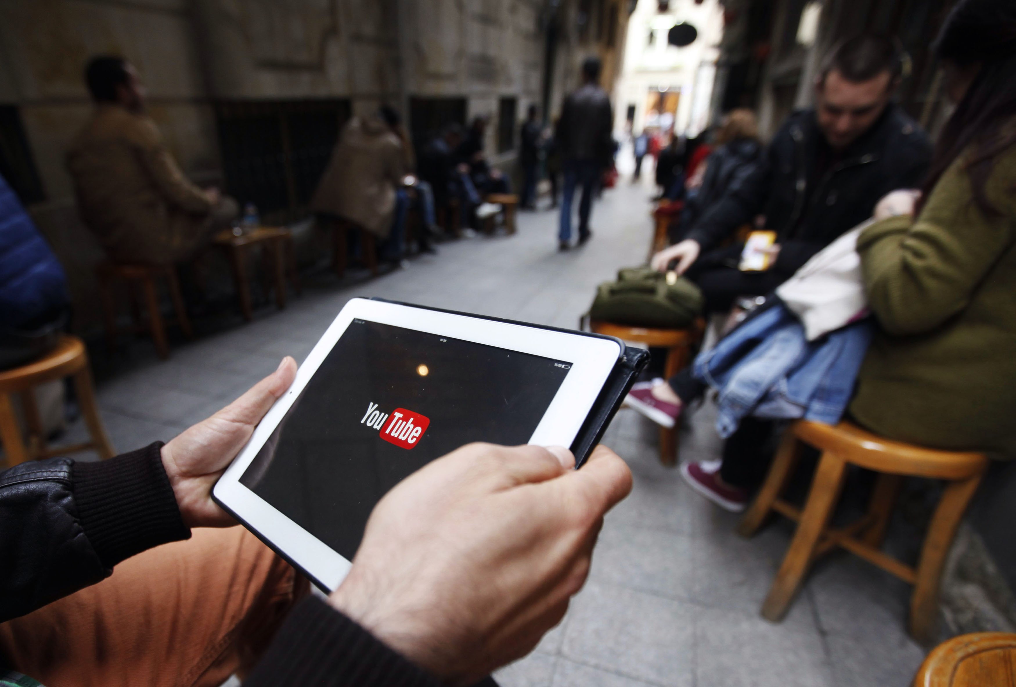 A man tries to get connected to the YouTube web site with his tablet at a cafe in Istanbul March 27, 2014. u00e2u20acu201d Reuters pic