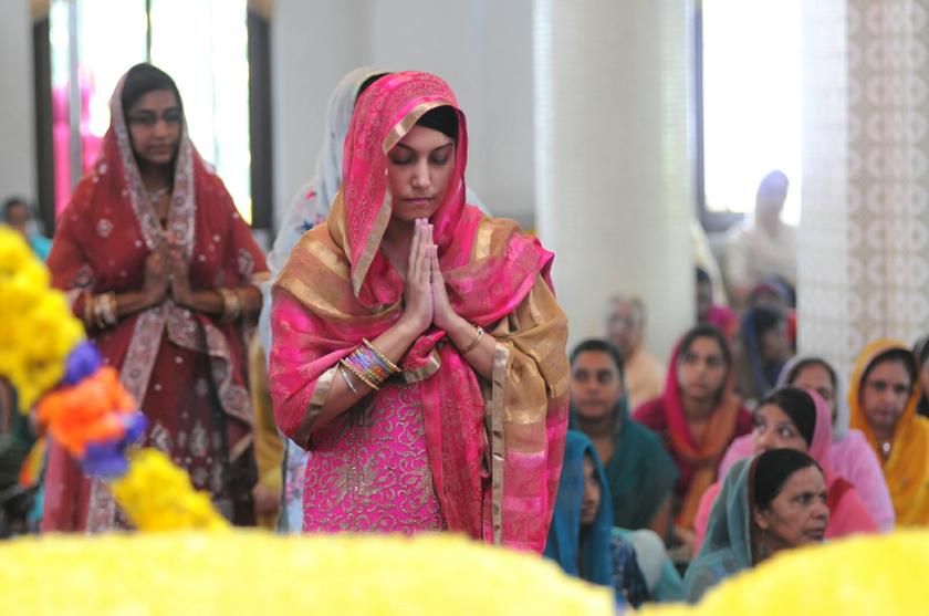 A devotee praying to the holy book during Vaisakhi celebrations at Wadda Gurdwara Sahib in Penang, April 14, 2014. u00e2u20acu201d Picture by K.E. Ooi