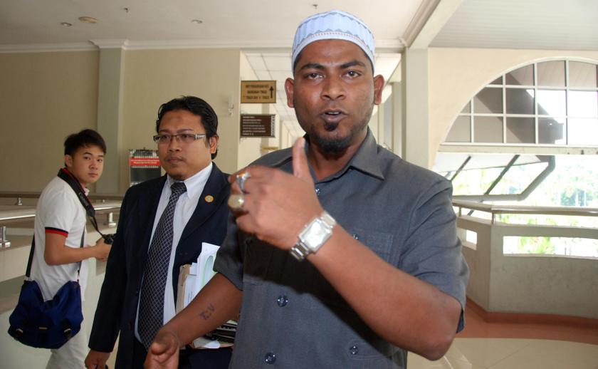 Viran Nagapan, who now goes by his Muslim name Izwan Abdullah, is seen outside the High Court in Seremban on April 7, 2014. u00e2u20acu201d Picture by Yusof Mat Isa