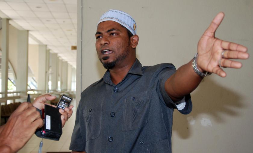 Viran Nagapan, who now goes by his Muslim name Izwan Abdullah, is seen outside the High Court in Seremban on April 7, 2014. u00e2u20acu201d Picture by Yusof Mat Isa