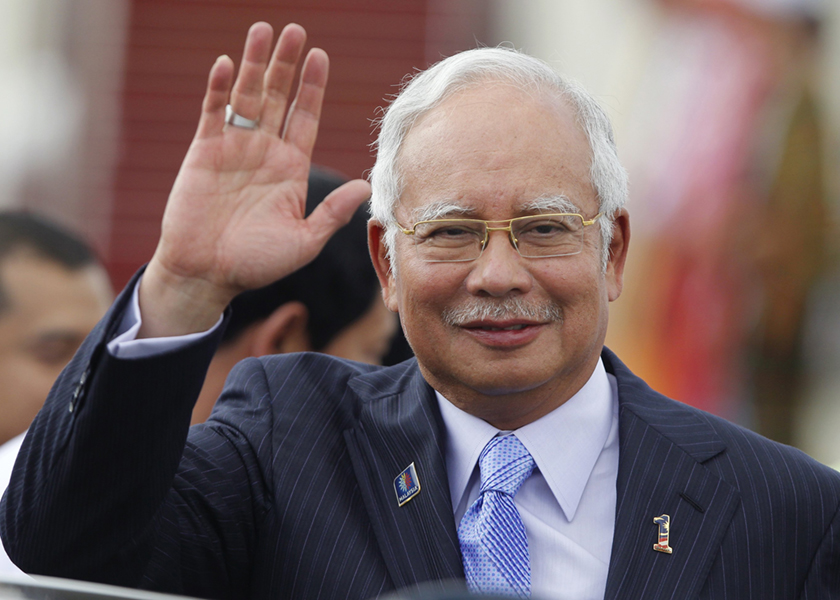 Malaysia's Prime Minister Najib Razak waves as he arrives at Naypyitaw international airport to attend 24th ASEAN Summit May 10, 2014. u00e2u20acu201d Reuters pic