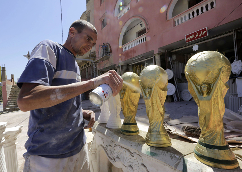 Ahmed has been making replicas of the trophy to sell to fans since 2010, where Algeria qualified for the World Cup for third time, May 6, 2014. u00e2u20acu201d Reuters