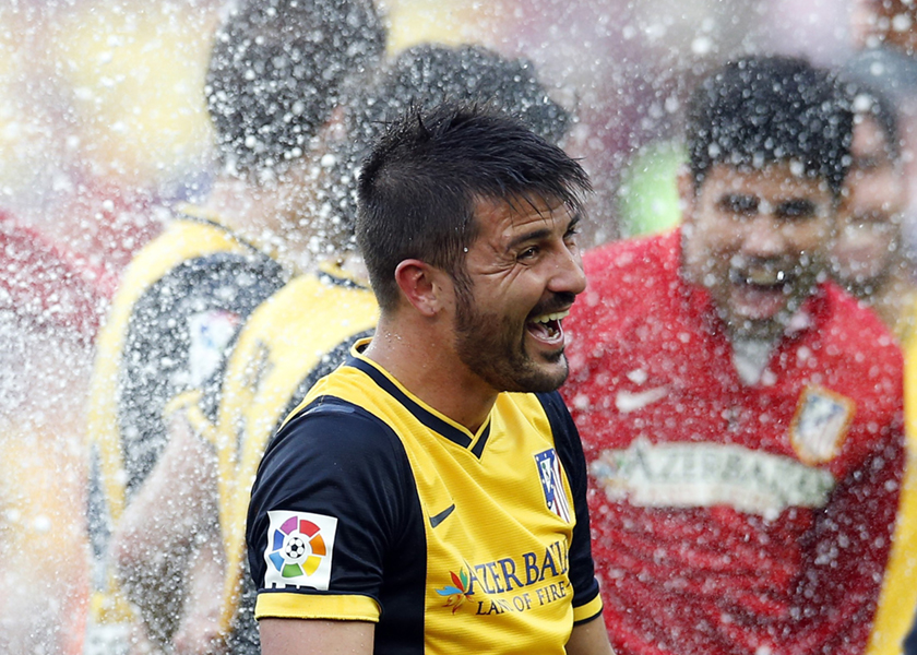 Atletico Madrid's David Villa celebrates after winning the Spanish first division title following their soccer match against Barcelona at Camp Nou stadium in Barcelona May 17, 2014. u00e2u20acu201d Reuters pic