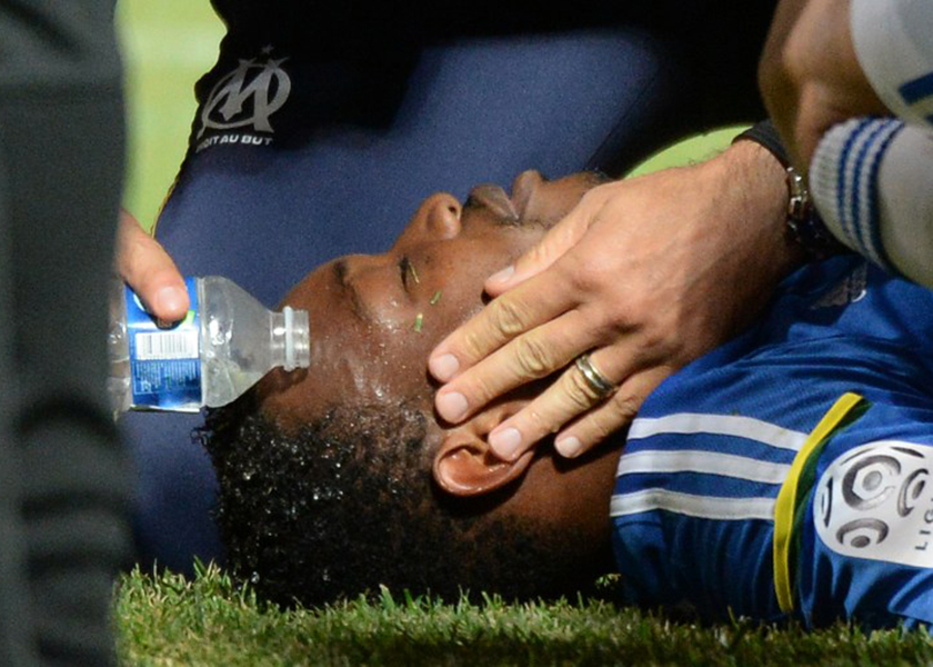 Marseille's French goalkeeper Steve Mandanda is treated after being injured during a French L1 football match between Marseille and Guingamp at the Velodrome stadium in Marseille on May 17, 2014. u00e2u20acu201d AFP pic