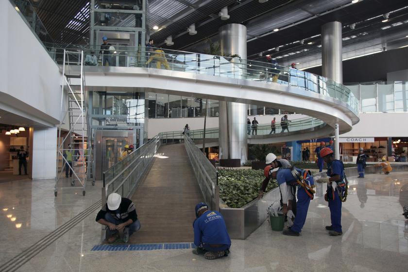 Labourers work at the new international terminal 3 at Guarulhos International airport in Sao Paulo May 10, 2014. u00e2u20acu201d Reuters pic