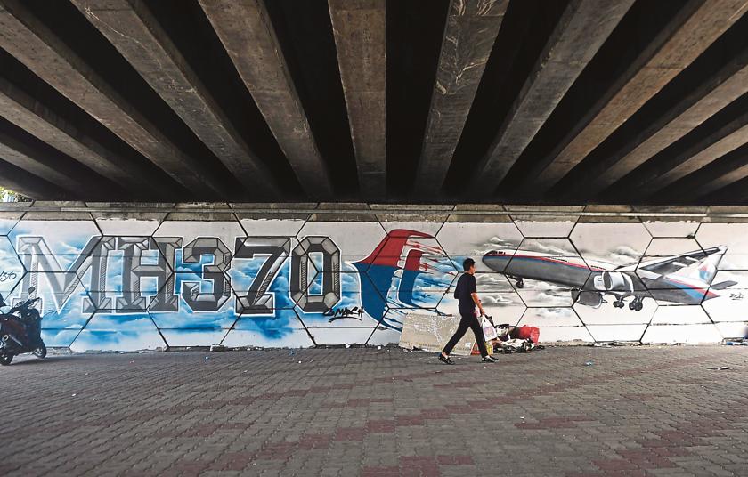 This graffiti of Flight MH370 below the flyover near Jalan Ampang is an apt reminder that Malaysians must be taught how to manage emotions. — Picture by The Malay Mail