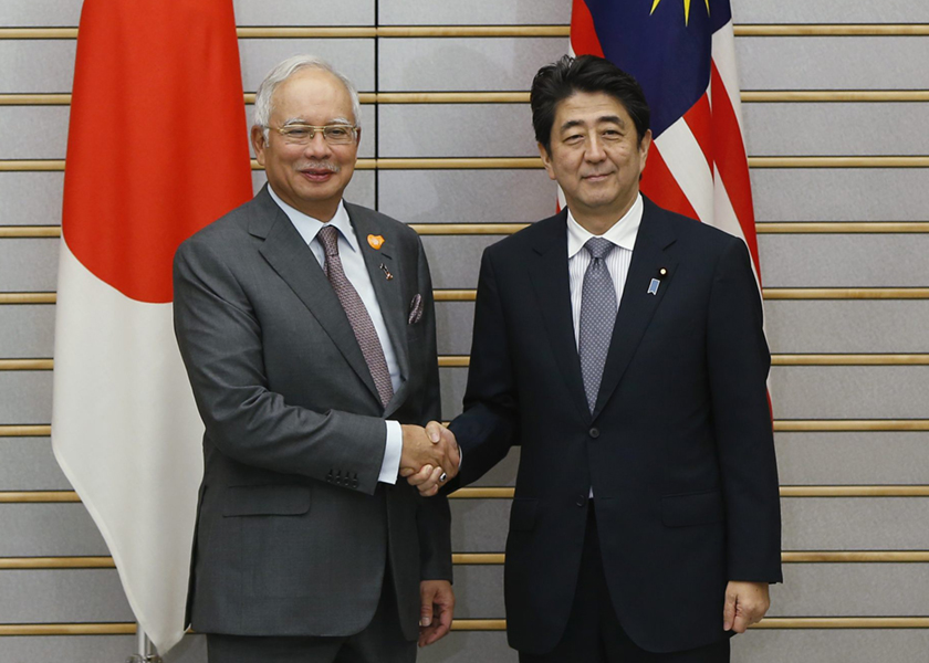 Malaysia's Prime Minister Datuk Seri Najib Tun Razak (left) shakes hands with Japan's Prime Minister Shinzo Abe at the start of their talks at Abe's official residence in Tokyo May 21, 2014. u00e2u20acu201d Reuters pic