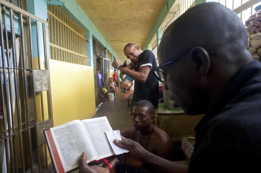 A prisoner reads the Bible in the old wing of the Najayo prison which is being renovated in San Cristobal, May 13, 2014. Ten years after the country opened its first prison designed with a focus on education and clean living conditions and staffed by graduates from a newly created academy for penitentiary studies, the New Model of Prison Management is gaining recognition from other countries in the region trying to reduce prison populations and cut recidivism rates. Picture taken May 13, 2014. — Reuters pic
