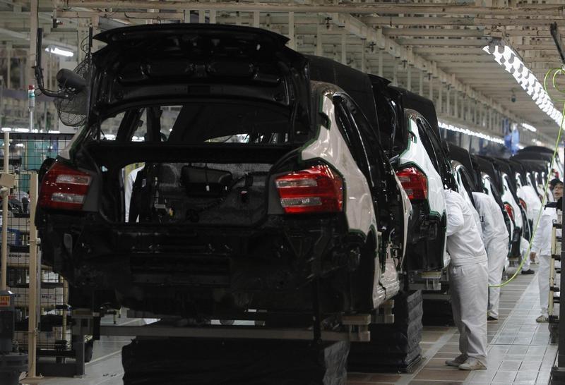Thai workers work at a sedan line production at Honda Automobile in Rojana Industrial Park, Ayutthaya province, about 80 km (50 miles) north of Bangkok, March 31, 2012. — Reuters pic