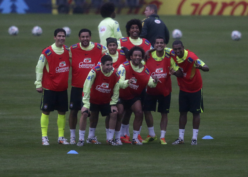 Brazil's national soccer team players (top left to right) Hernanes, Fred, Neymar, Dante, Dani Alves, Fernandinho and (bottom) Oscar and Marcelo Vieira pose after a training session in Teresopolis, near Rio de Janeiro May 28, 2014. u00e2u20acu201d Reuters pic