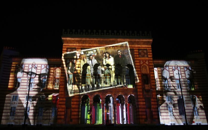 3D mapping projections of Bosnian writers were seen on the facade of the National Library during opening ceremony in Sarajevo May 9, 2014. Sarajevou00e2u20acu2122s landmark 19th century city hall-turned-National Library re-opened with its old glory fully restored. u00e2u20ac