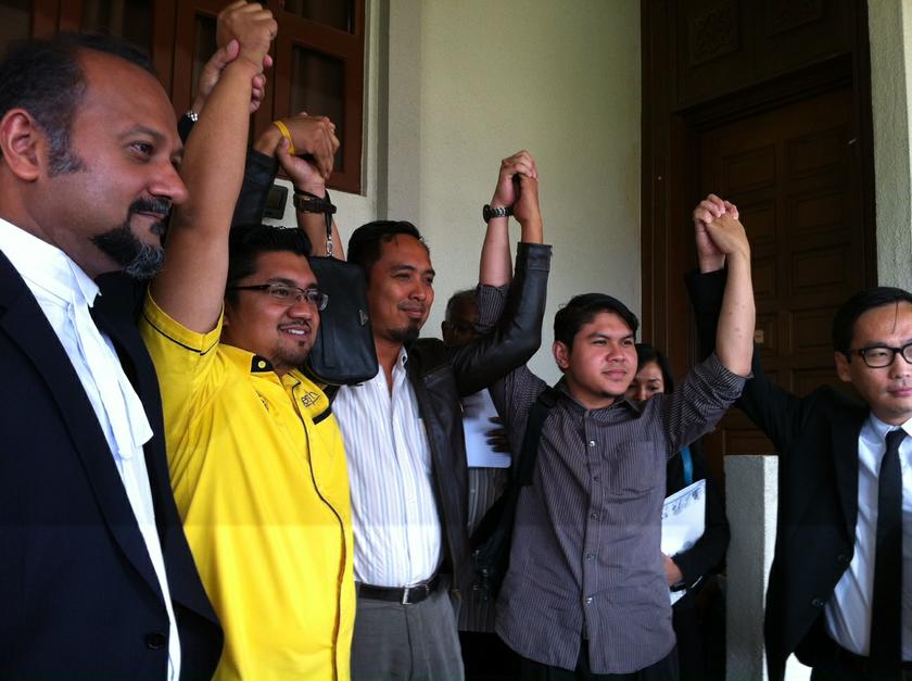 (From left) Lawyer Gobind Singh Deo; activists Chegubard, Edy Noor Reduan, Mohamed Bukhairy Sofian; and lawyer Eric Paulsen, after their hearing at the Sessions Court. u00e2u20acu201d Picture by Boo Su-Lyn