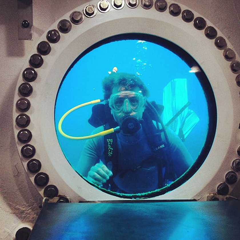 Fabien Cousteau, grandson of underwater pioneer Jacques-Yves Cousteau, looks through the window of the Aquarius habitat in the Florida Keys National Marine Sanctuary, Florida, in this undated handout picture provided by Mission 31.u00c2u00a0u00e2u20acu201d Reuters pic