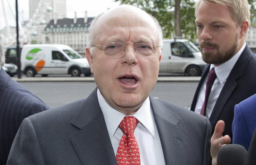 Pfizer Inc chairman and chief executive Ian Read arrives at Portcullis House to attend a parliamentary business and enterprise committee hearing on the future of AstraZeneca, in central London, May 13, 2014 Reuters