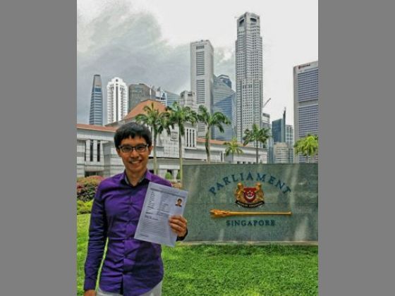 Blogger Roy Ngerng holding his NMP application outside Parliament House.Facebook page. 