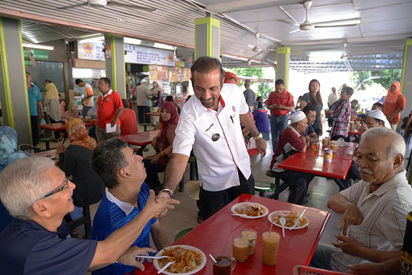 DAPu00e2u20acu2122s Ramkarpal Singh greets voters at the Taman Tun Sardon food court in Penang, May 24, 2014. u00e2u20acu201d Picture by K.E. Ooi