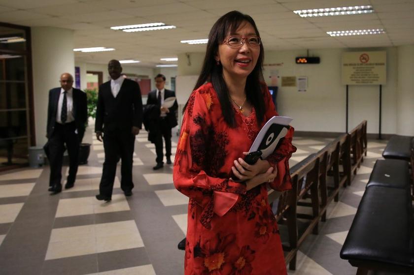 Teresa Kok smiles as she walks out of the KL High Court, May 6, 2014. u00e2u20acu2022 Picture by Saw Siow Feng