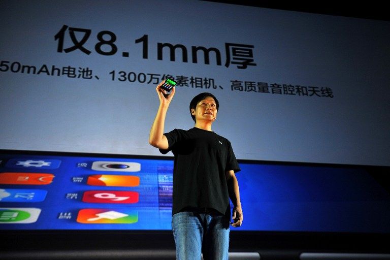 BEIJING : Xiaomi CEO Leijun shows a new Xiaomi smartphone at the launch of the new Xiaomi smartphone and Xiaomi Tv in Beijing on September 5, 2013. u00e2u20acu201d AFP pic