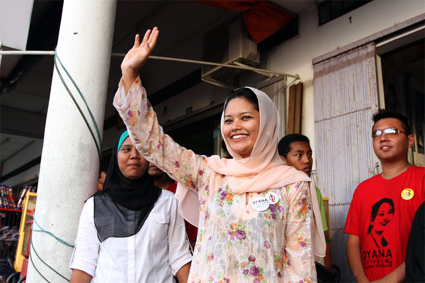 DAP's candidate for the Teluk Intan by-election Dyana Sofya Mohd Daud waves to residents during a walkabout in Teluk Intan, Perak, on May 23, 2014. u00e2u20acu201d Picture by Yusof Mat Isa