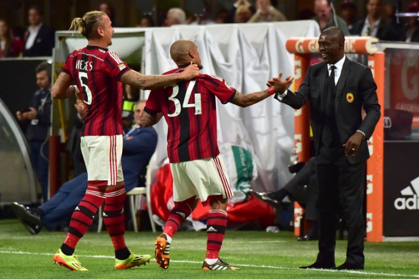 File picture shows AC Milanu00e2u20acu2122s Dutch midfielder Nigel de Jong (centre) celebrating with AC Milan's Dutch coach Clarence Seedorf (right) after scoring a goal in Milan on May 18, 2014. u00e2u20acu201d AFP pic