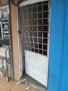 The door to the DAP office in Kuantan is damaged after being kicked by the protesters.