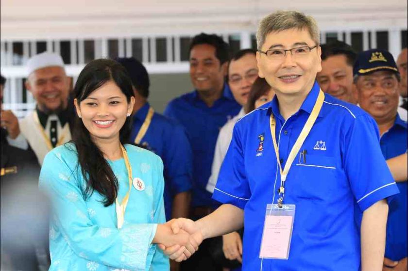 DAP candidate Dyana Sofya Mohd Daud shakes hands with BN candidate Mah Siew Keong on nomination day, Teluk Intan, May 19, 2014. u00e2u20acu201d Picture by Saw Siow Feng