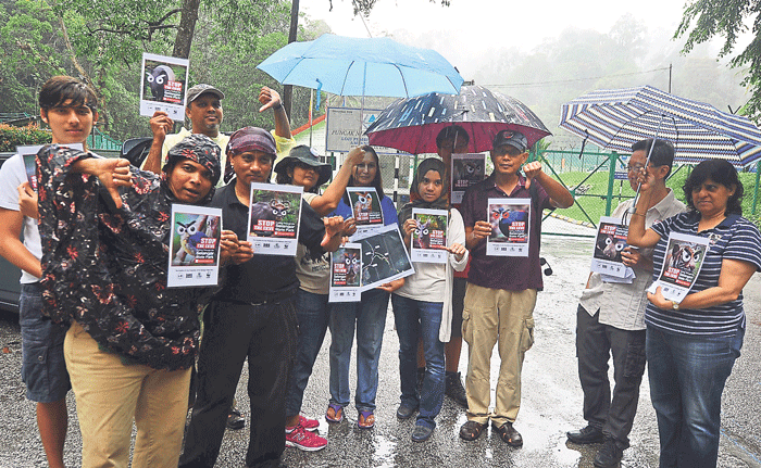 Representatives from the NGOs display posters saying u00e2u20acu02dcStop the EKVEu00e2u20acu2122. They say the proposed expressway may affect the quality of the water resources, and endanger the wildlife species, in the Selangor Forest Reserve. u00e2u20acu201d Malay Mail pic