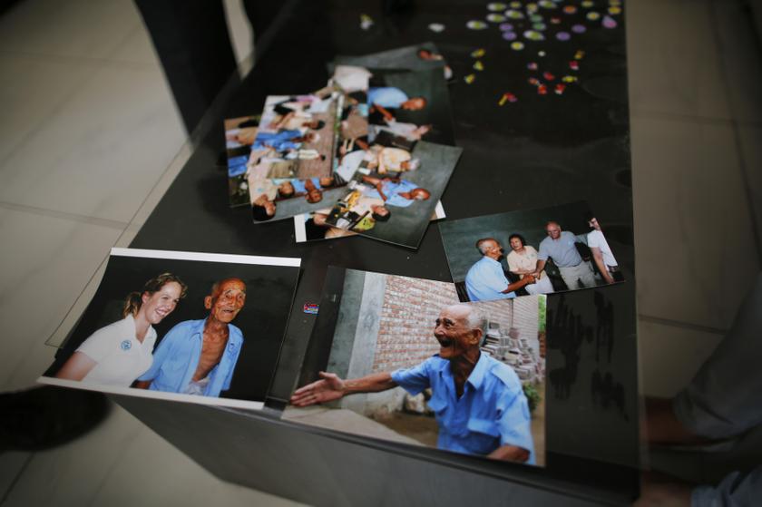 Pictures of Liu Guolian's father Liu Qian, who was a forced labourer by Mitsui Mining to work in their mines in Fukuoka of Japan, are seen on a table during an interview with Reuters on the outskirts of Beijing, April 28, 2014.   u00e2u20acu201d Reuters pic
