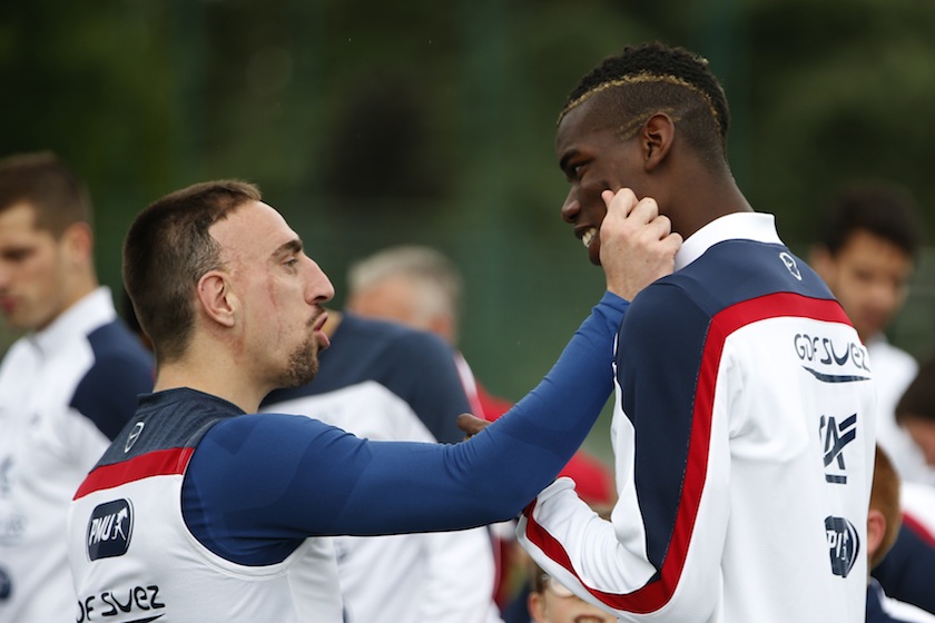 France's national team forward Franck Ribery (left) jokes with Paul Pogba during a training session in Clairefontaine, near Paris, 23, 2014.u00c2u00a0u00e2u20acu201d Reuters pic