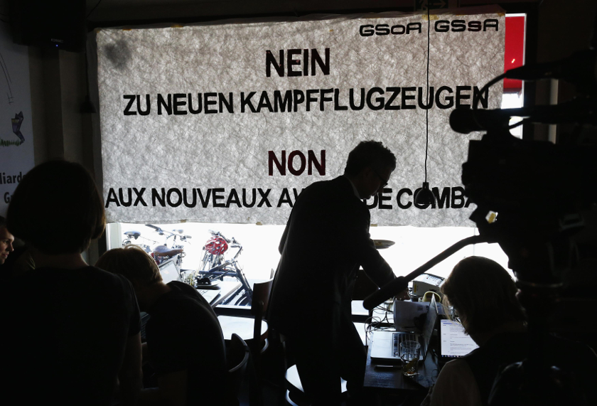 Members of the 'Gripen referendum committee' follow the results on the vote in Bern May 18, 2014. u00e2u20acu201d Reuters pic