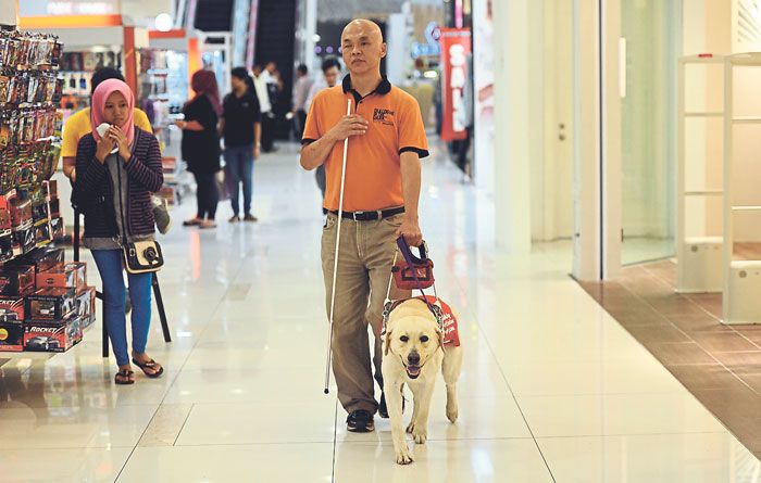 Stevens Chan walked inside Capital Mall Asia for 10 minutes before he was ordered to leave by security. u00e2u20acu201d Picture by Azinuddin Ghazali