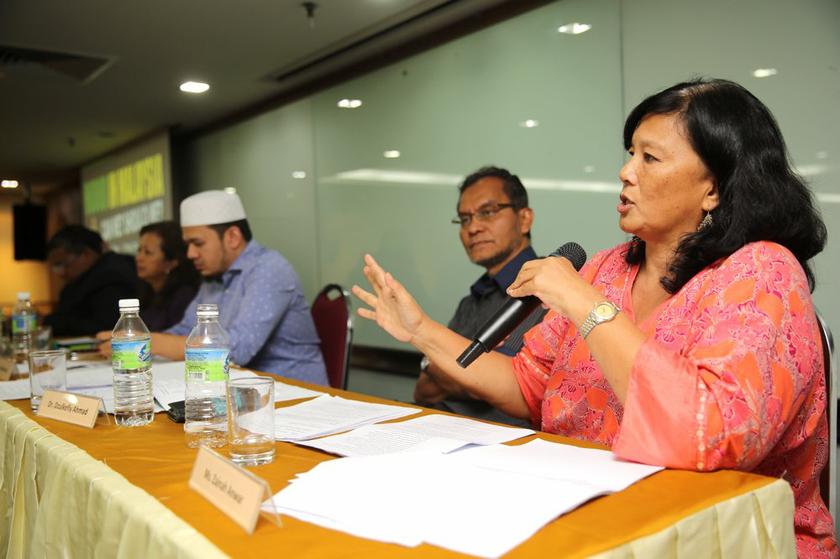 Co-founder and director of Musawah Zainah Anwar (right) speaks during the 'Hudud in Malaysia, Can We? Should We?' forum at the KLSCAH in Kuala Lumpur, on May 11, 2014. u00e2u20acu2022 Picture by Choo Choy May