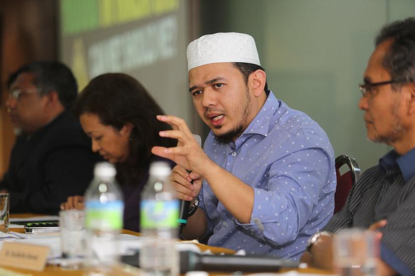 Umno Youth Exco Fathul Bari speaks during the 'Hudud in Malaysia, Can We? Should We?' forum at the KLSCAH in Kuala Lumpur, on May 11, 2014. u00e2u20acu2022 Picture by Choo Choy Mayn