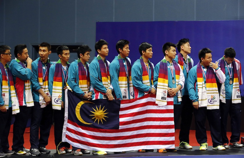 Malaysia's team members stand on the podium during the trophy presentation ceremony of the Thomas Cup badminton championship in New Delhi May 25, 2014. Malaysia won the silver. u00e2u20acu201d Reuters pic