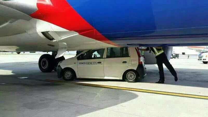 An airside vehicle hit the belly of a Malaysia Airlines plane bound for Yangon at the Kuala Lumpur International Airport, on May 15, 2014.
