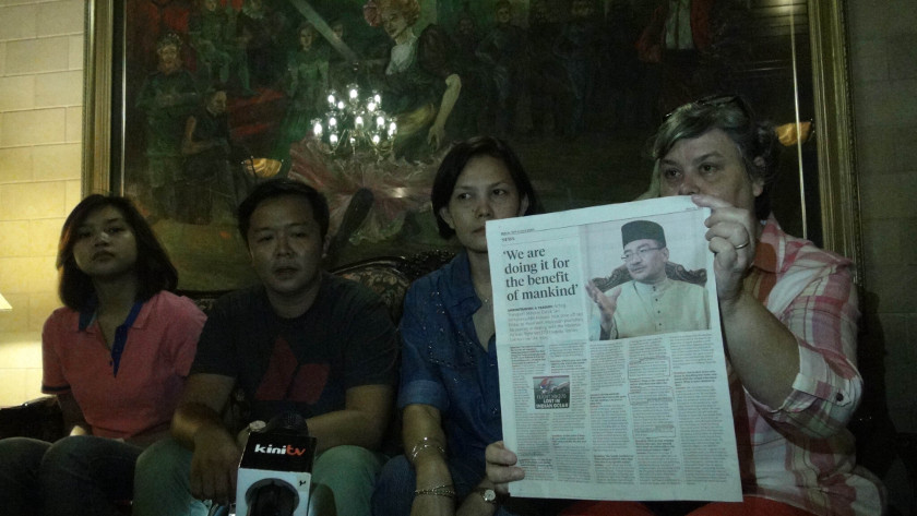 Family members of the crew on flight MH370: (From left) Maira Elizabeth Nari, Kelvin Shim, Melanie Antonio, and Jacquita Gonzales, on May 18, 2014. u00e2u20acu201d Picture by Pathmawathy Subramaniam