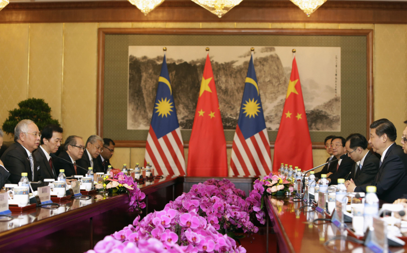 Prime Minister Najib Razak (left) talks with China's President Xi Jinping (right) during a meeting at the Diaoyutai State Guesthouse in Beijing, May 30, 2014. u00e2u20acu201d Reuters pic