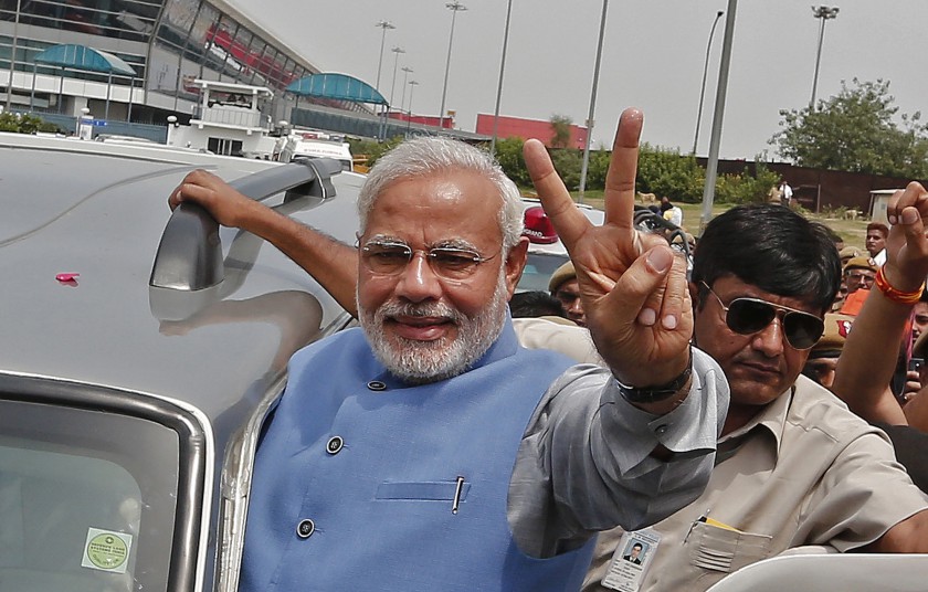 Hindu nationalist Narendra Modi, the prime ministerial candidate for Indiau00e2u20acu2122s Bharatiya Janata Party (BJP), gestures towards his supporters on arrival at the airport in New Delhi May 17, 2014. u00e2u20acu201d Reuters pic