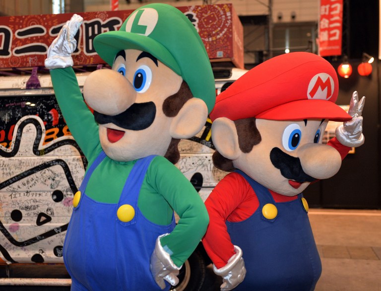 File photo shows Japanese videogame giant Nintendou00e2u20acu2122s characters Super Mario and Luigi (left) performing in Chiba, suburban Tokyo. u00e2u20acu201d AFP pic