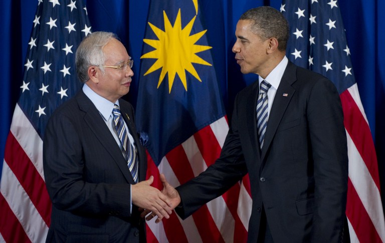 Researchers said the strength of a handshake grip may reveal aging rate and education level. File photo shows US President Barack Obama shaking hands with Prime Minister Datuk Seri Najib Tun Razak in Bali, November 18, 2011.  u00e2u20acu201d AFP pic