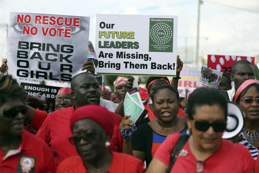 People hold signs during a protest demanding the release of abducted secondary school girls from the remote village of Chibok, in Lagos, May 5, 2014. The Islamist militant group Boko Haram claimed responsibility for the abduction of more than 200 schoolgirls. — AFP pic 