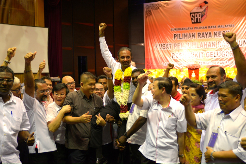 Ramkarpal Singh is carried by DAP leaders and members after the Bukit Gelugor official results were announced, on May 25, 2014. u00e2u20acu201d Picture by K.E. Ooin