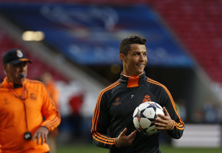 Real Madrid's Cristiano Ronaldo laughs as coach Carlo Ancelotti uses his whistle during a training session at the Luz stadium one day before their Champions League soccer final match against Atletico Madrid, in Lisbon May 23, 2014. u00e2u20acu201d Reuters pic