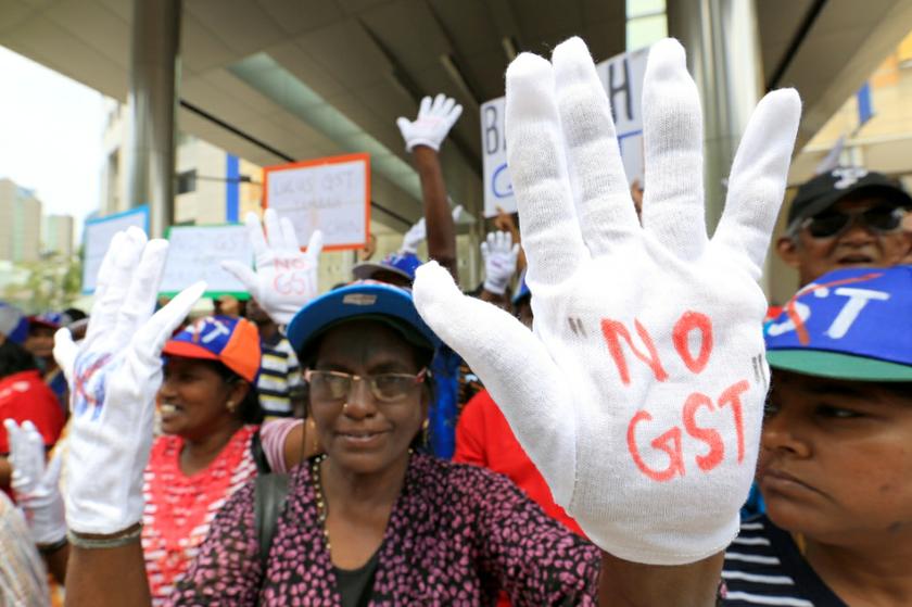 Crowds have gathered at various locations in Kuala Lumpur by noon before converging at Dataran Merdeka for an anti-GST rally, May 1, 2014. — Picture by Saw Siow Feng