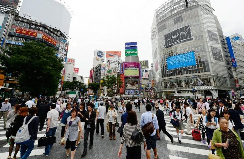 People cross a busy intersection in Tokyou00e2u20acu2122s Shibuya shopping district on June 6, 2013. u00e2u20acu201d AFP pic